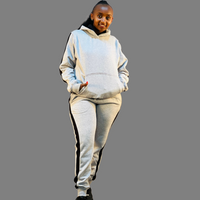 Stylish grey Ribbed Hoodie set for women with black stripes.