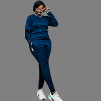 Image of a logo-free Navy Blue sweatsuit for women, featuring subtle stripes on the V-neck and cuffs, ideal for both casual and active wear